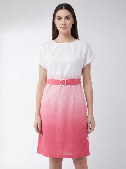 Woman wearing a white top and pink skirt with a belt on a white background